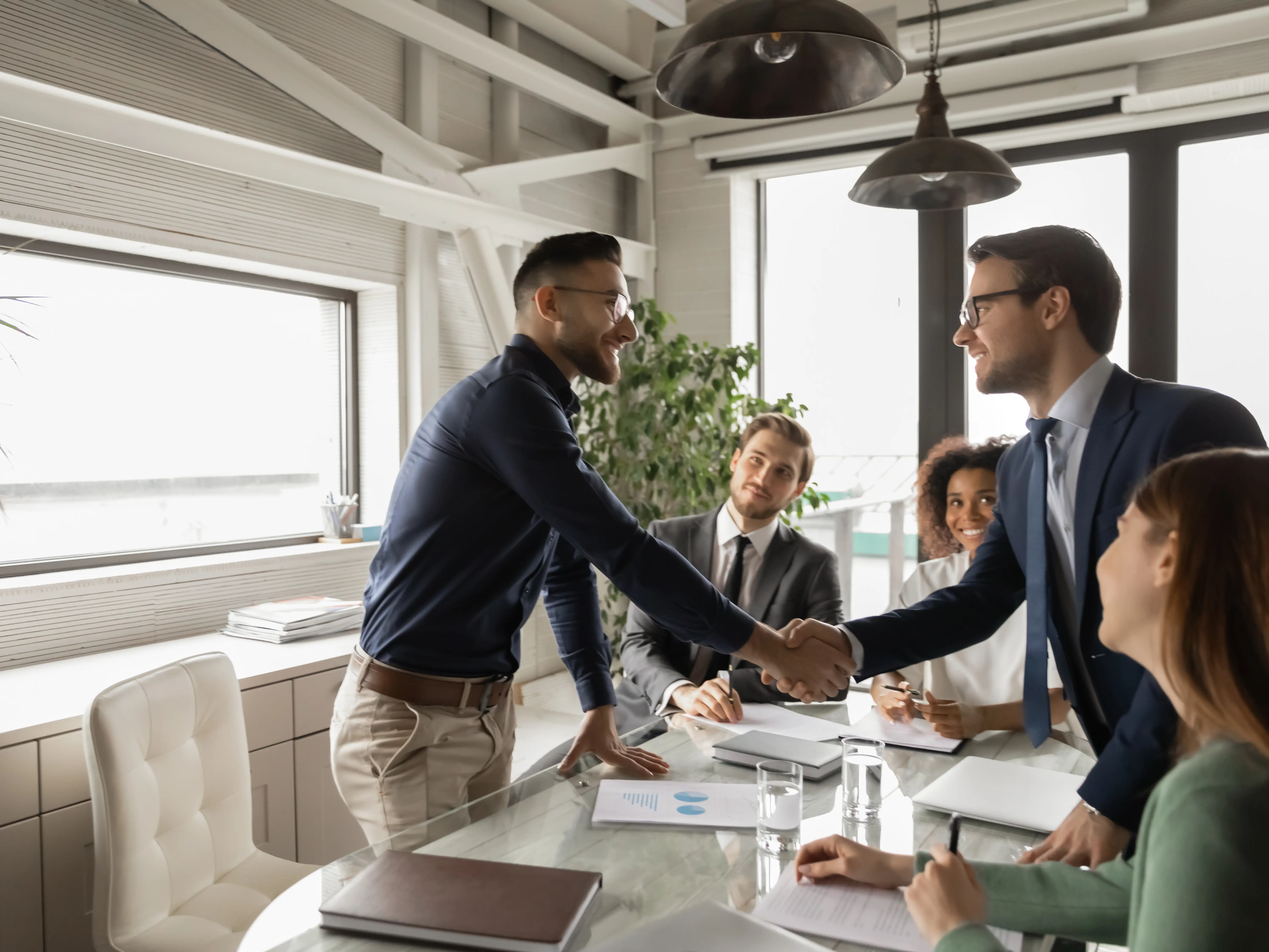 Boardroom meeting handshake